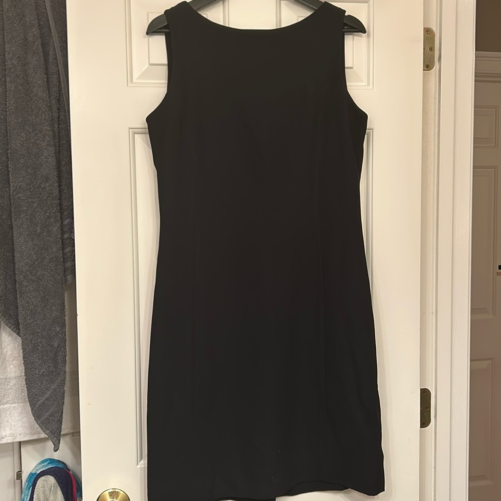 Classic little black dress. Boat neck, zip back, above knee length